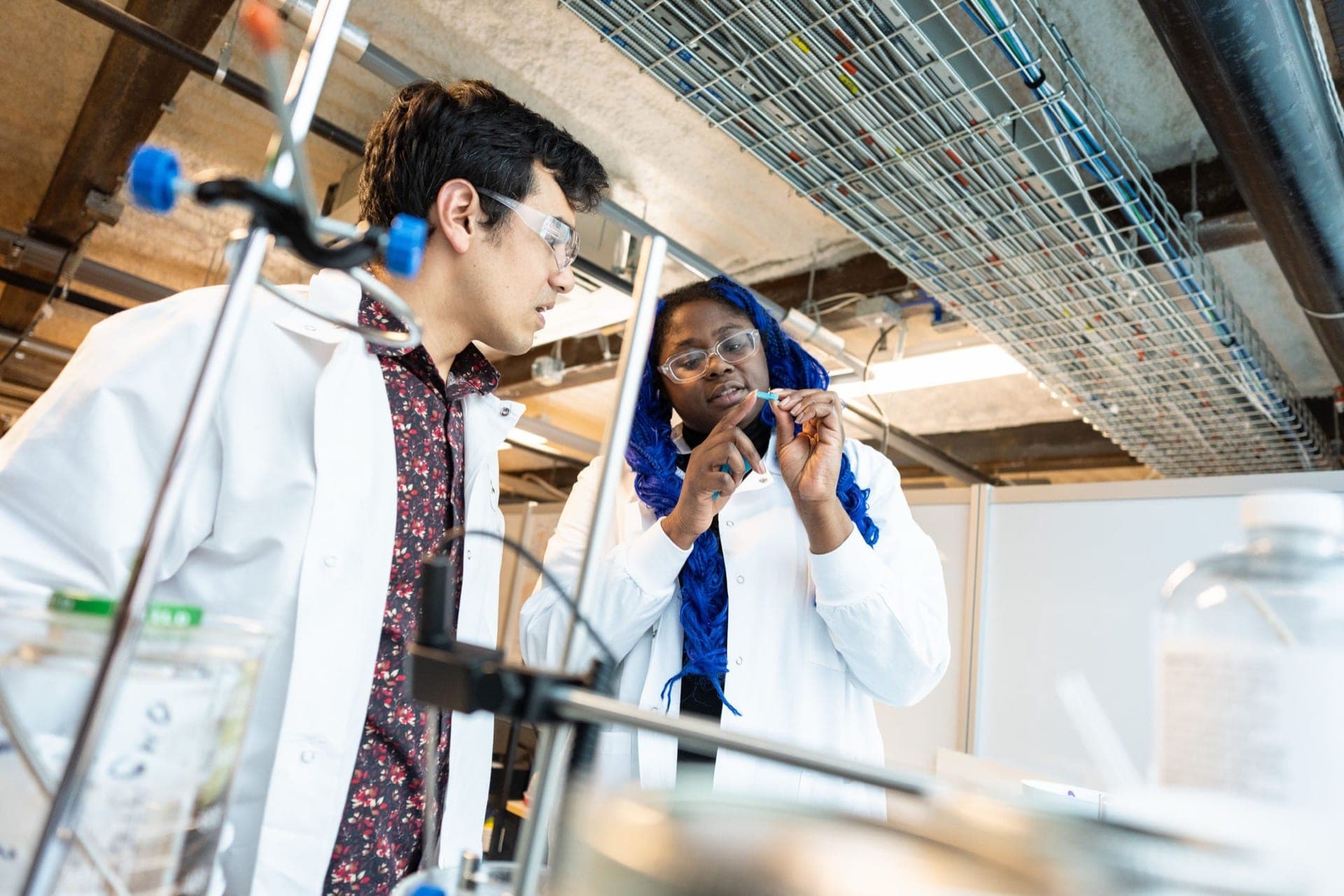 Members examining a sample in the Greentown Boston prototyping lab