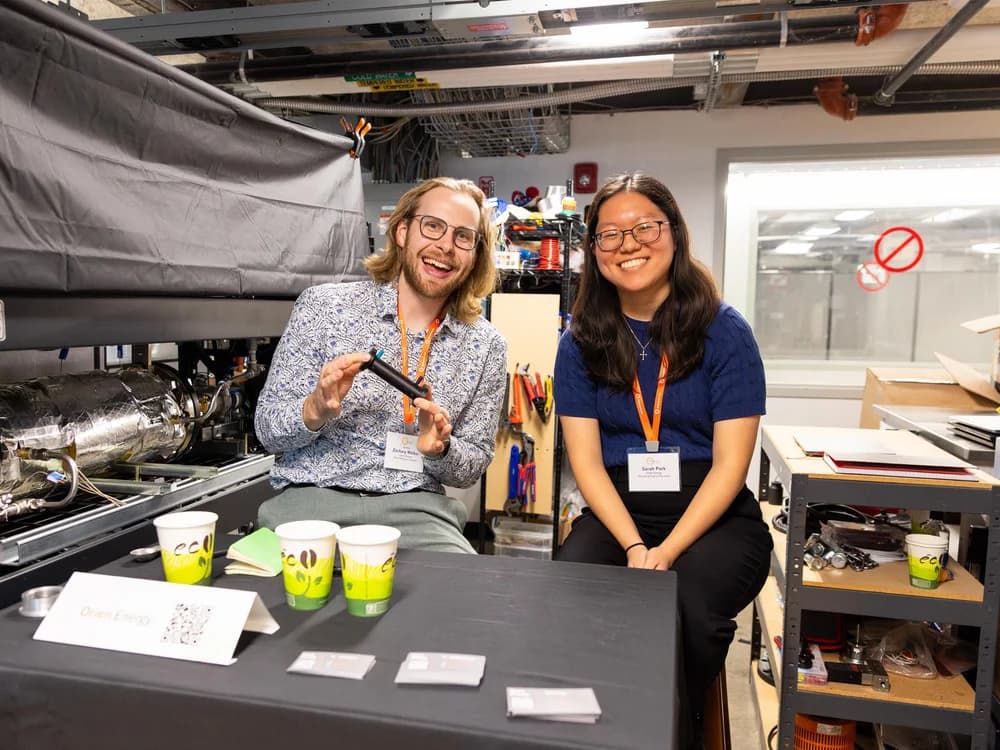Greentown Boston founders demoing hardware at a startup booth