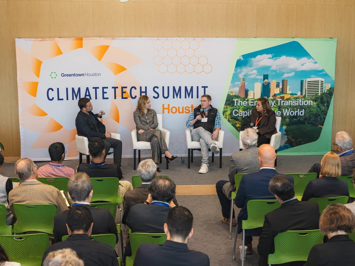 A panel discussion on stage at a past Greentown Houston Climatetech Summit