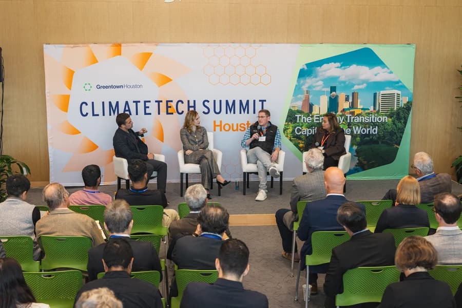 A fireside chat panel on stage at a past Greentown Houston Climatetech Summit