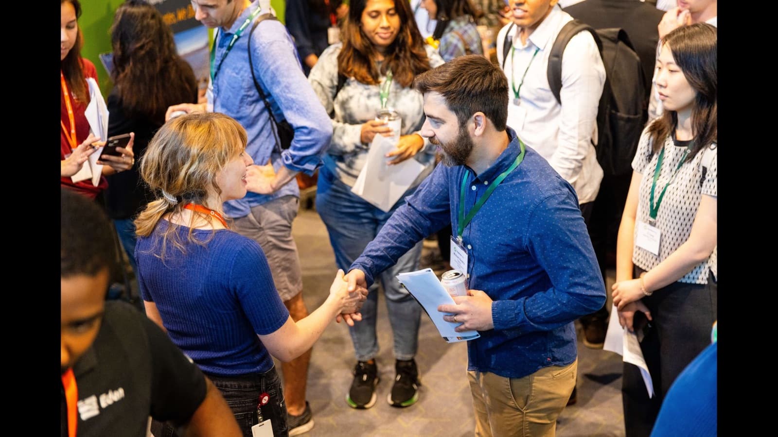 Attendees shaking hands and connecting at a Greentown Labs event