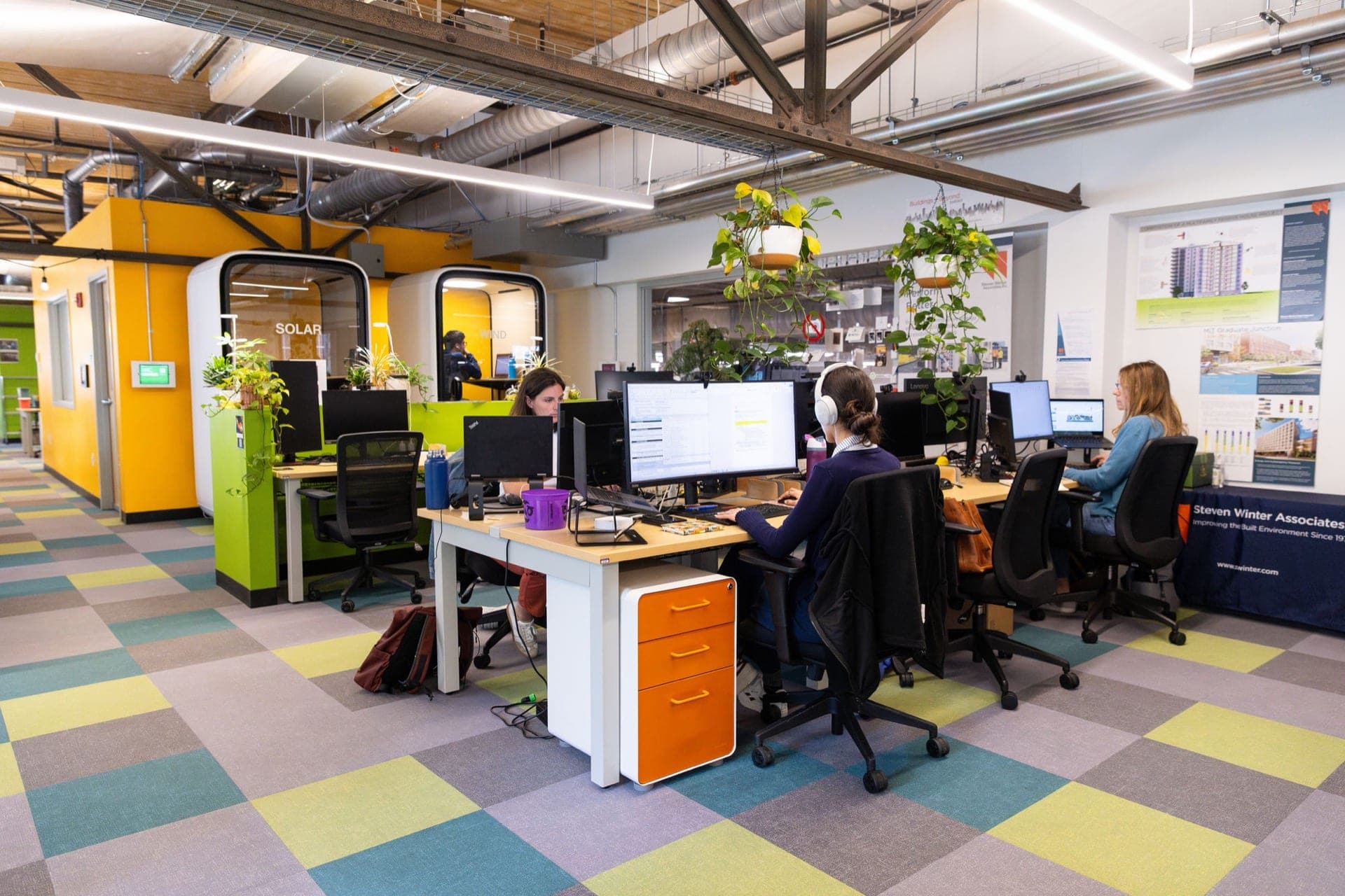 Members working at desks in the Greentown Boston coworking space