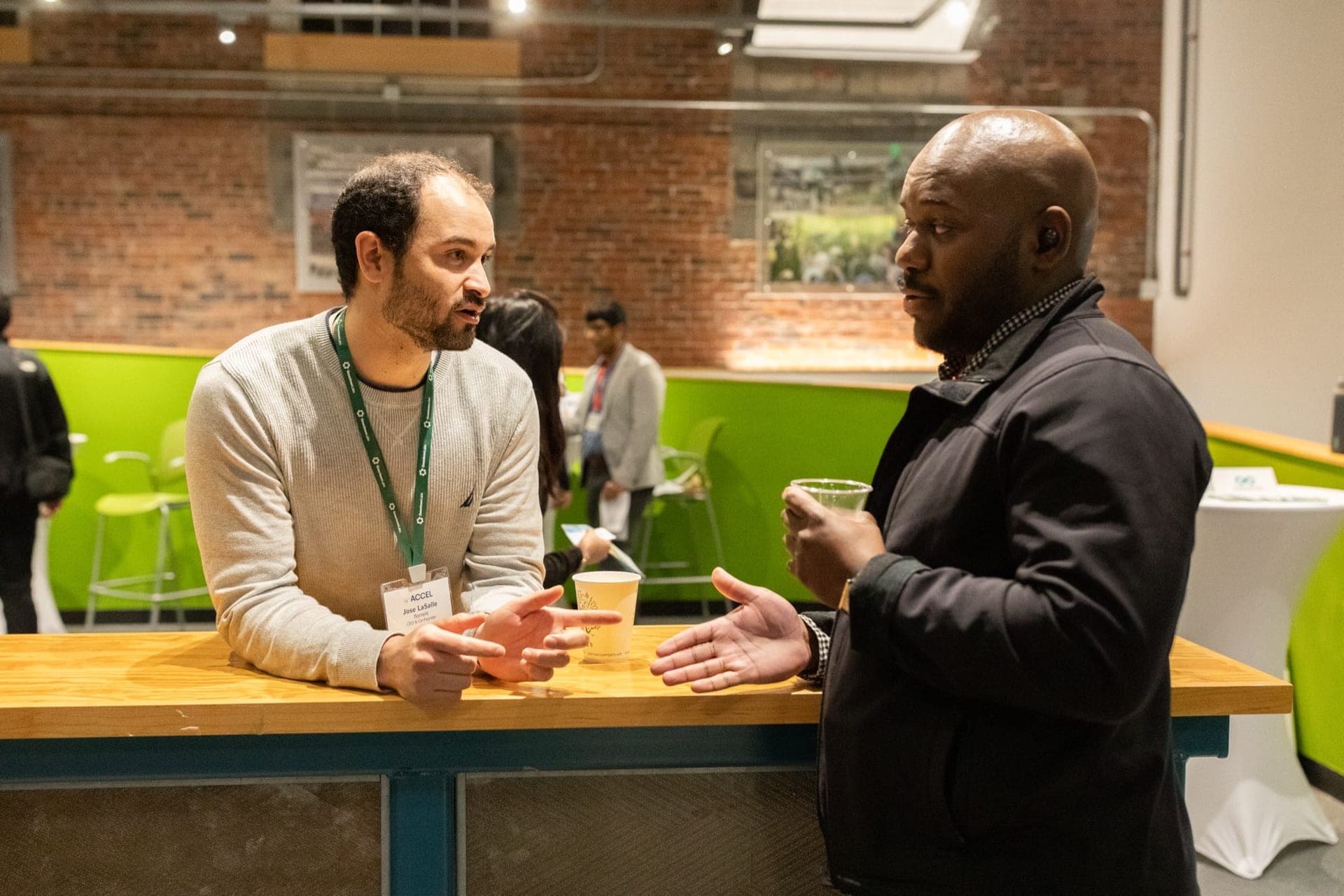 A mentor and founder in conversation at a Greentown Labs event