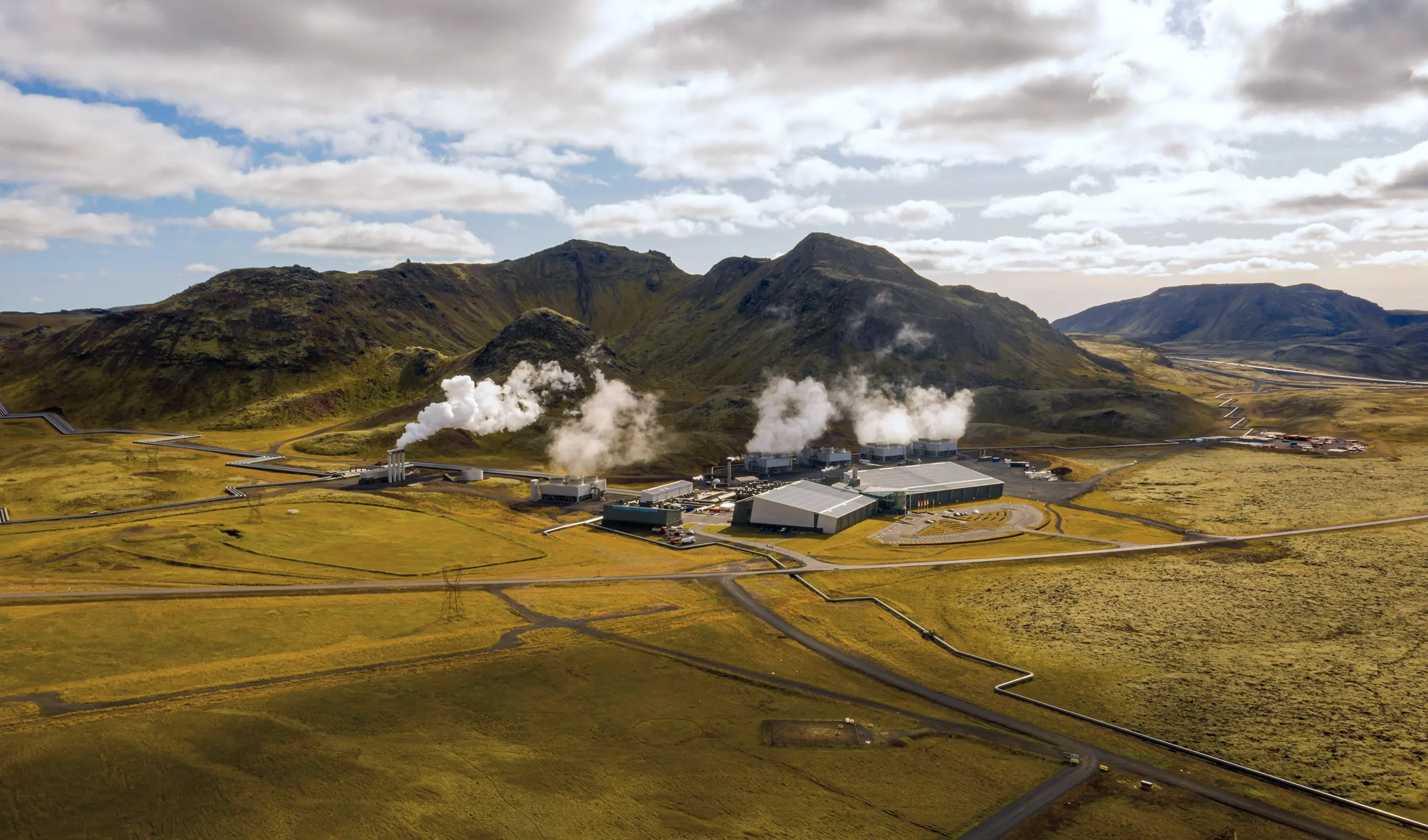 Geothermal energy plant nestled in a volcanic landscape